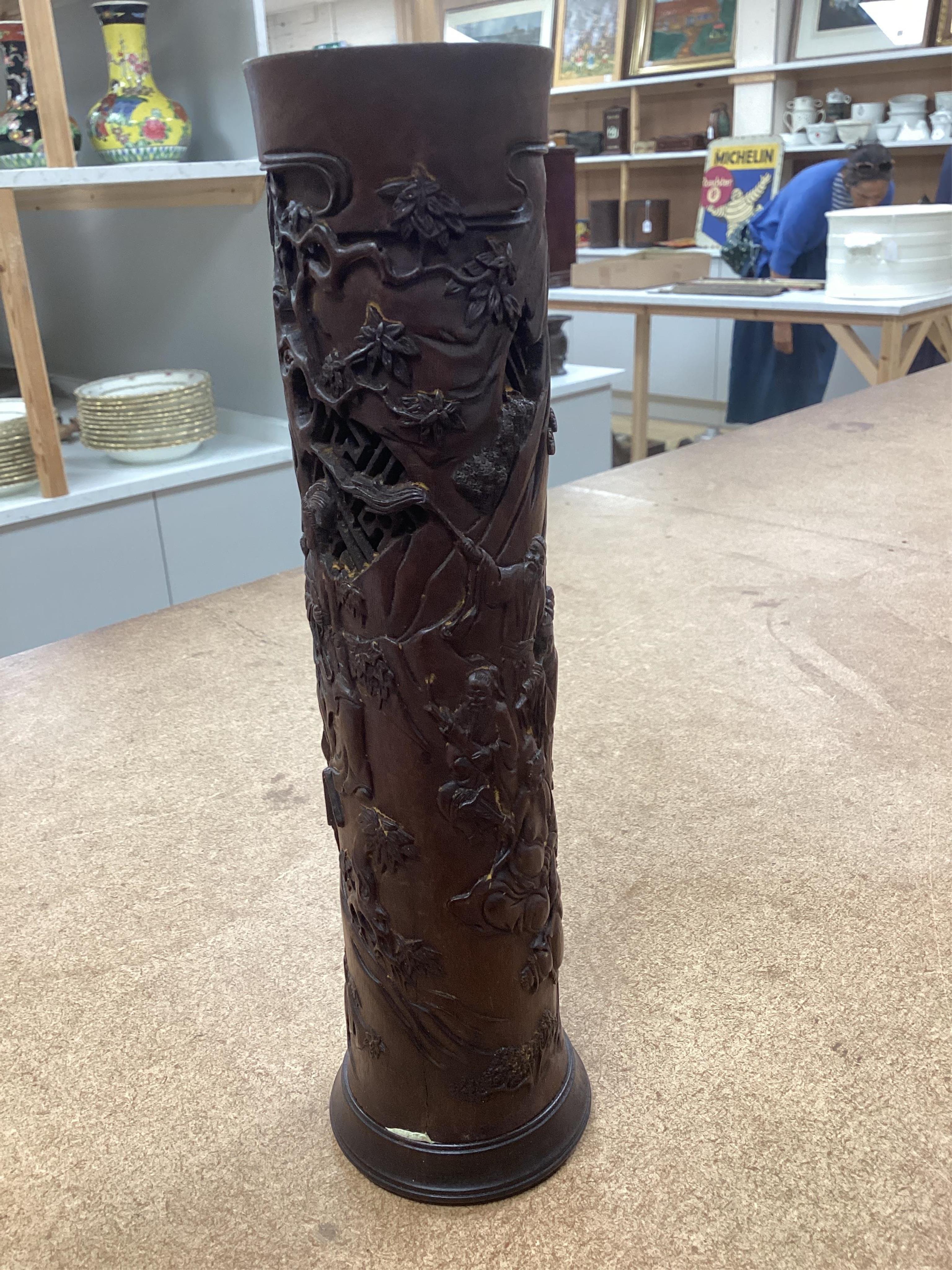 A pair of Chinese hardwood incense holders carved with trees and figures, cased, 29cm high. Condition - good